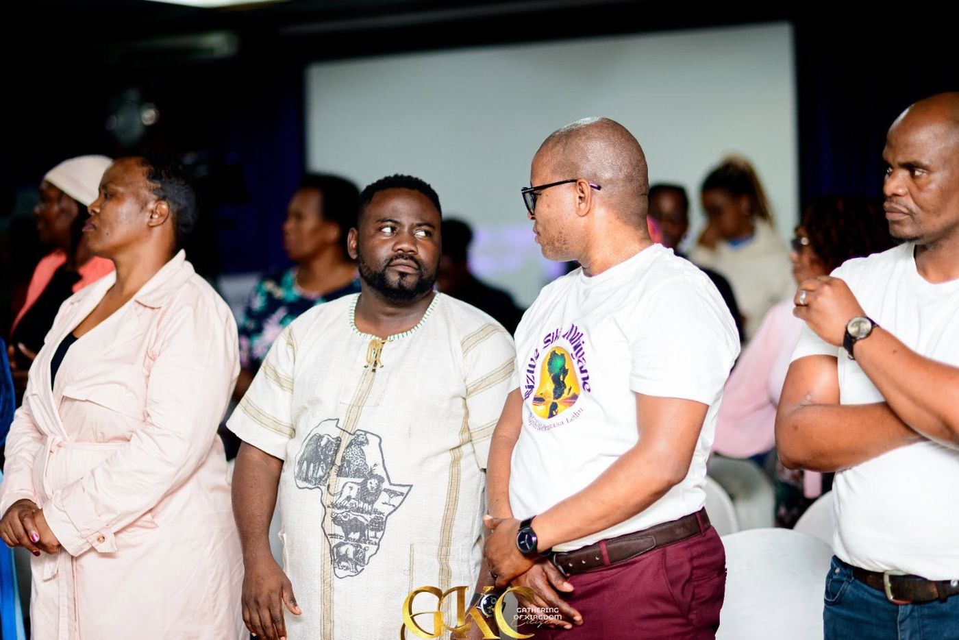 Members standing in worship